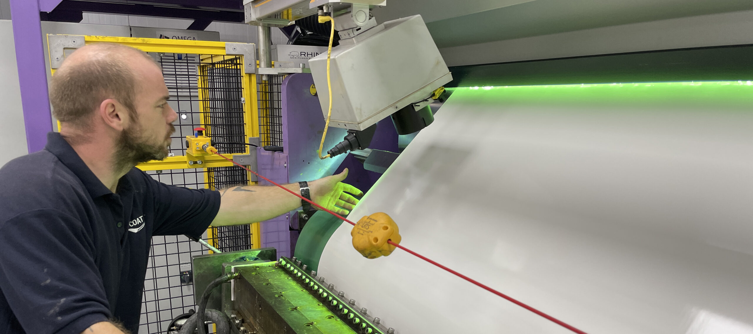 Hot melt adhesive is applied to the web and instantly cured when exposed to UV light.