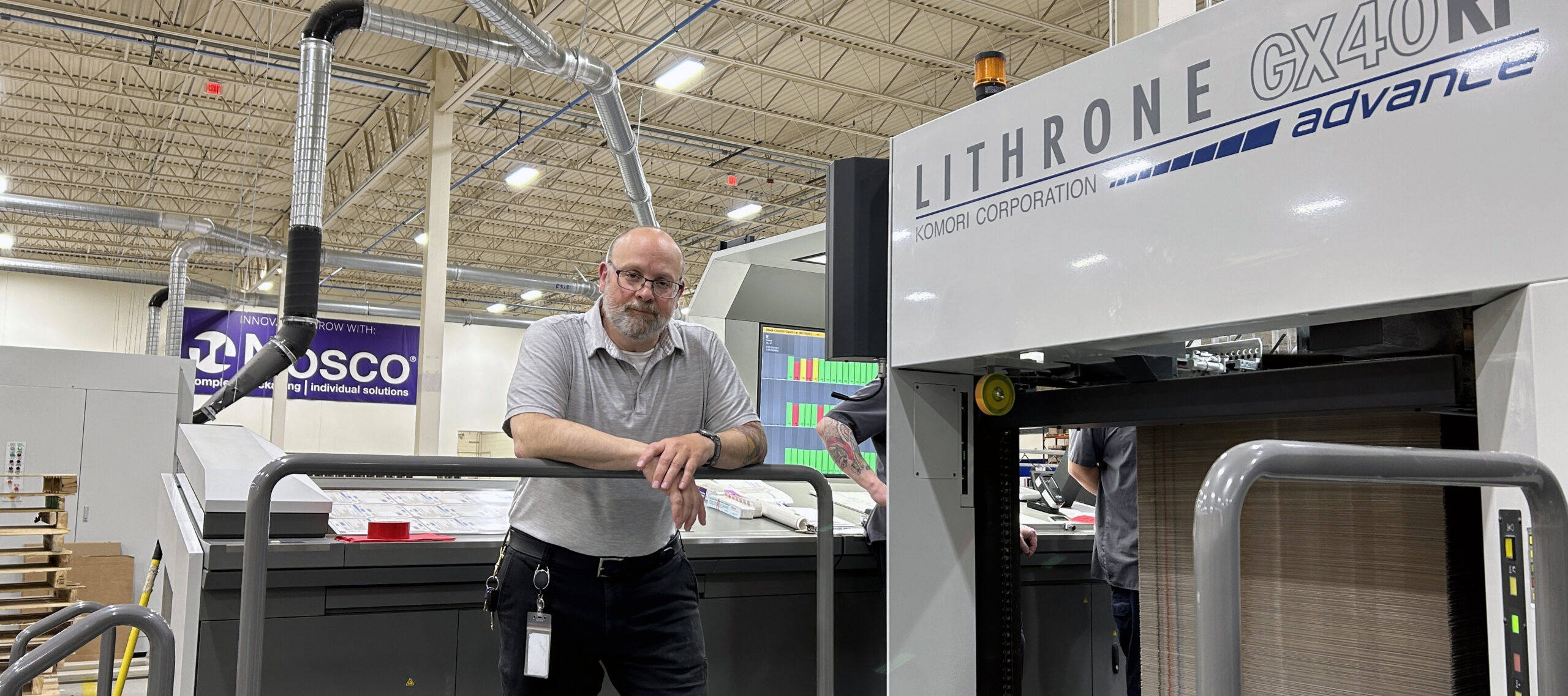 Lee Marcoe, Strategic Operations Manager, with the Komori GLX940RP-A press at Nosco's Pleasant Prairie facility in Wisconsin.
