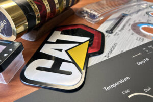 Products include IMD and IMSE items, membrane switches, metal nameplates, domed products and labels.